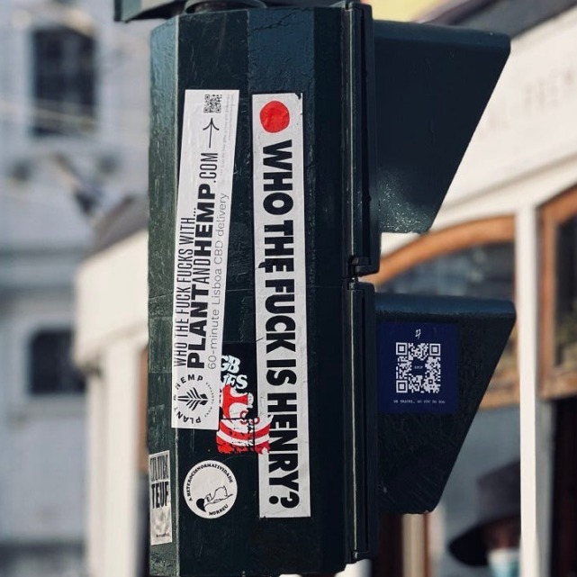 'Who the fuck is Henry?' sticker on a street pole