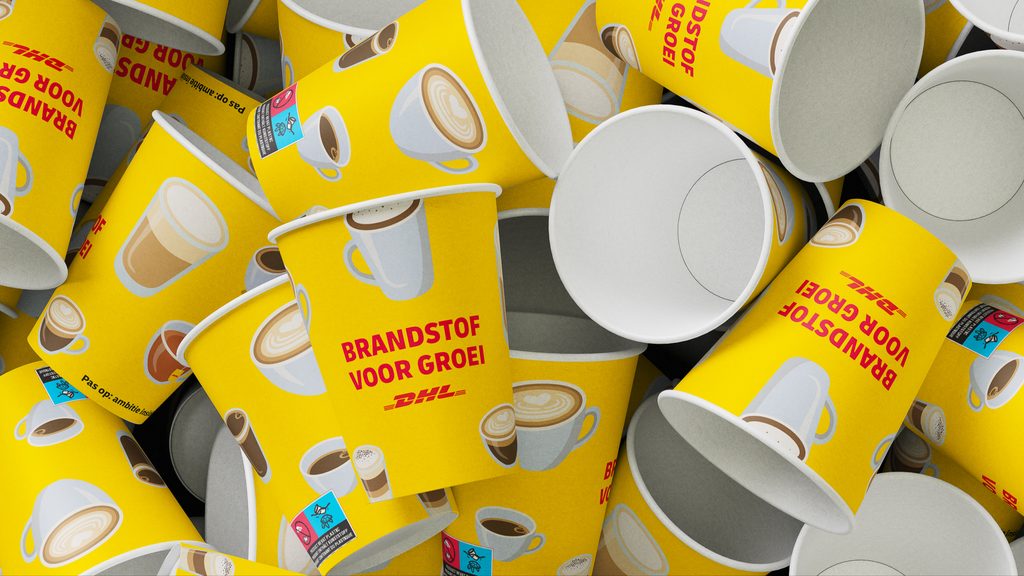 The stand’s branded coffee cups — “Brandstof voor groei”