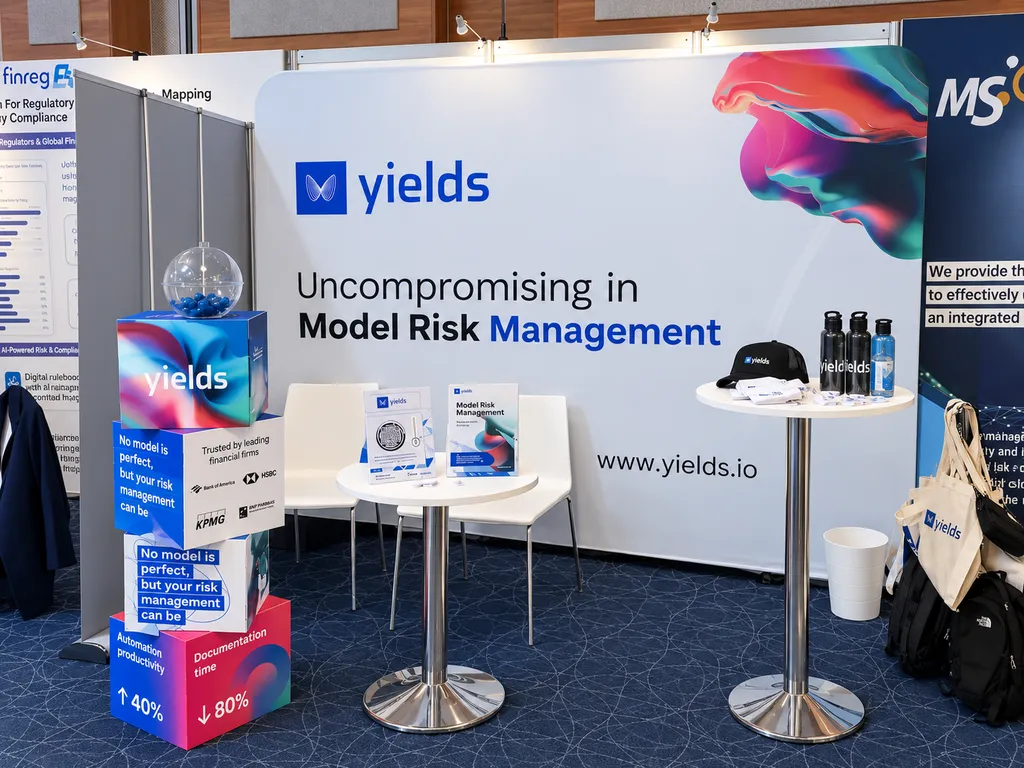 The Yields event stand, branded across cubes, printed collateral and merchandise